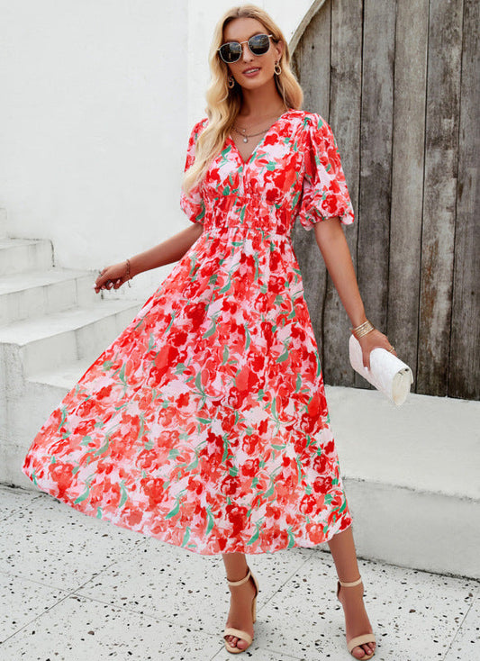 Elegante vestido largo con escote en V y sutil estampado