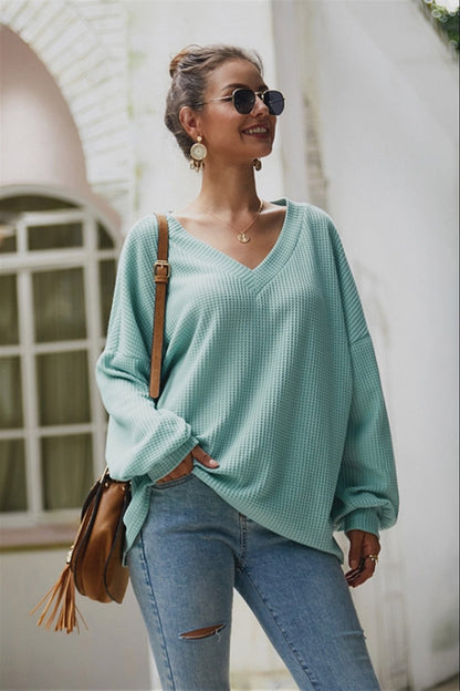 Jersey holgado de manga larga y cuello de pico para mujer