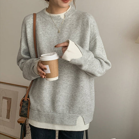Esmeralda Jersey oversize gris y blanco con recortes