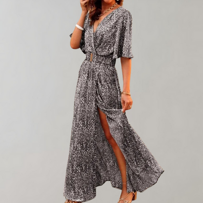 Vestido largo fluido con escote profundo y mangas anchas