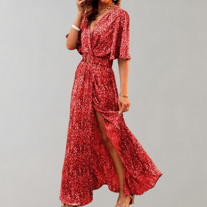 Vestido largo fluido con escote profundo y mangas anchas